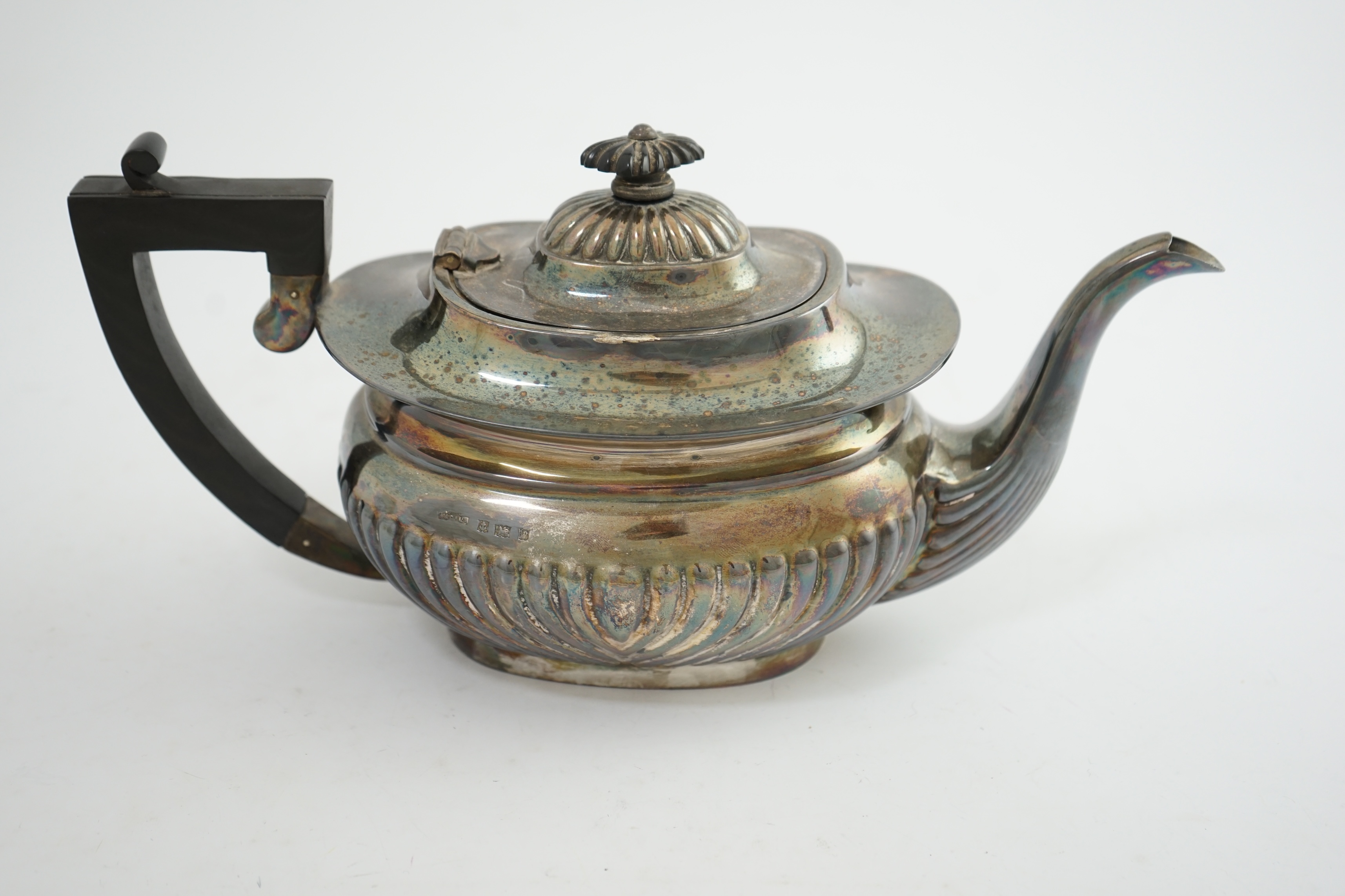 An Elizabeth II demi-fluted silver teapot, by Asprey & Co Ltd